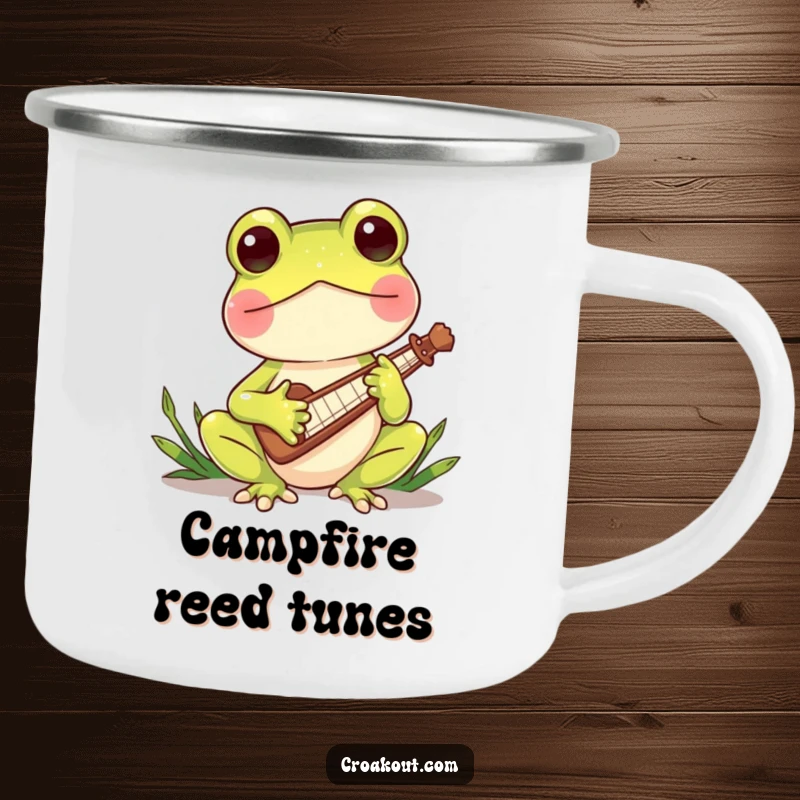 Funny camping mug featuring a charming frog character playing a miniature reed instrument, ideal for outdoor relaxation and enjoying musical moments.