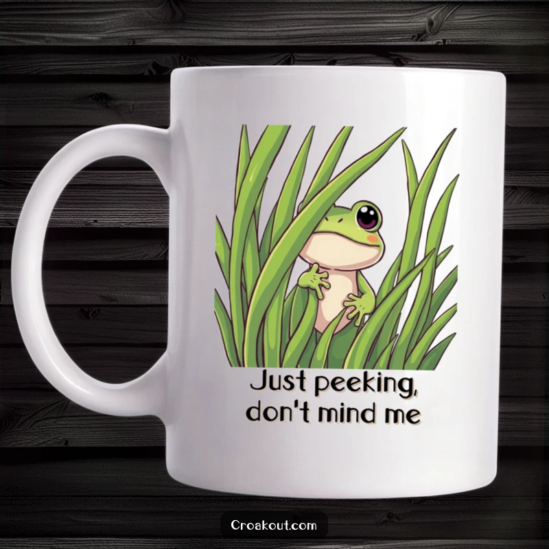 Funny frog mug showing a curious character peeking from behind a lush green blade of grass, full of wonder and playful mischief.