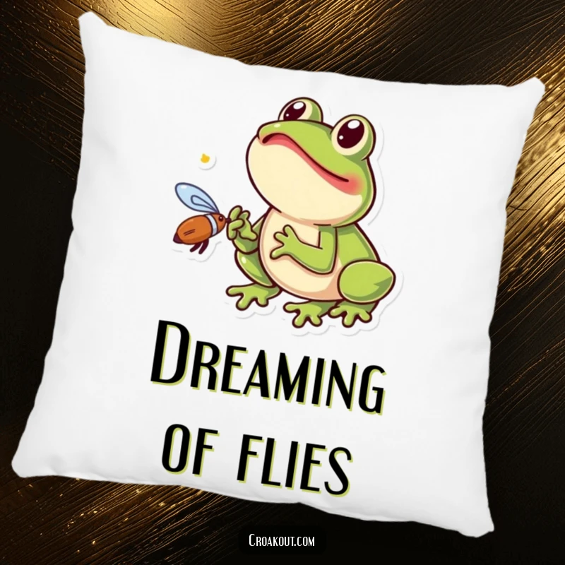 Funny frog pillow showing a small amphibian excitedly catching a fly with its tongue, a humorous and cozy decorative item.