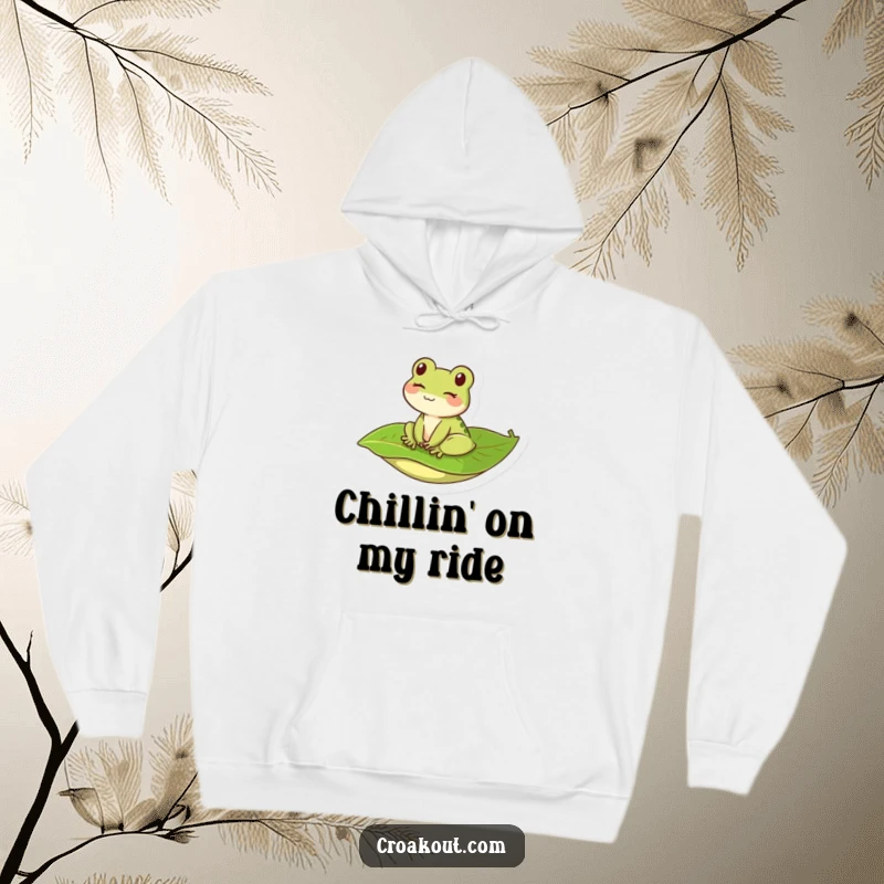 Funny and cozy hoodie with a kawaii frog winking while riding a leaf, offering warmth and humorous charm.