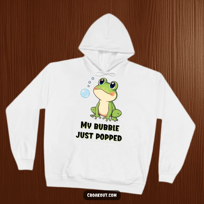 Funny hoodie depicting a frog character looking shocked as a bubble pops, exuding relatable, humorous surprise.