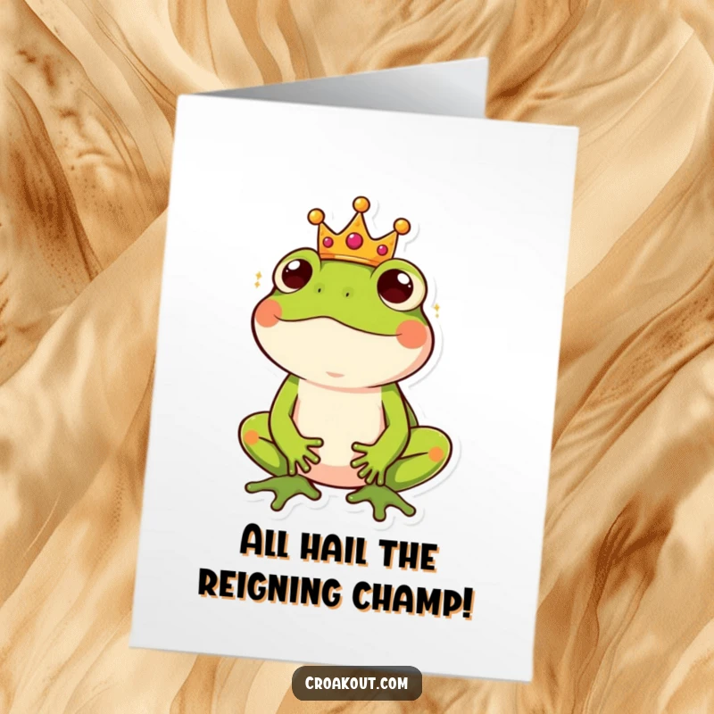 Funny Free Printable Congrats Card: A frog dons a tiny crown, looking amused and regal, celebrating a grand achievement.