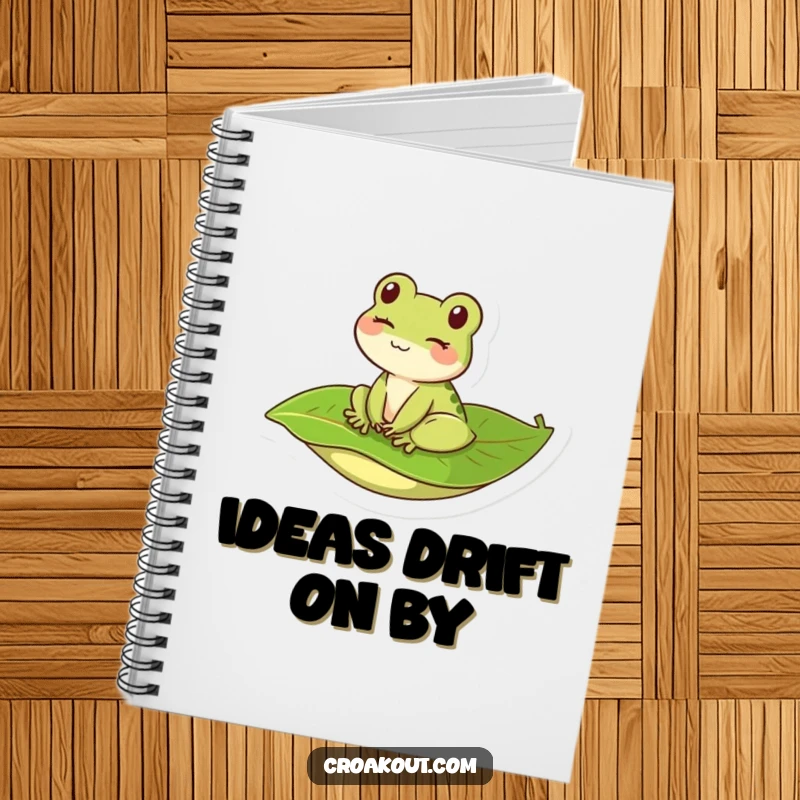Funny kawaii frog winking on a leaf, adorning a notebook perfect for jotting down notes with a touch of humor.