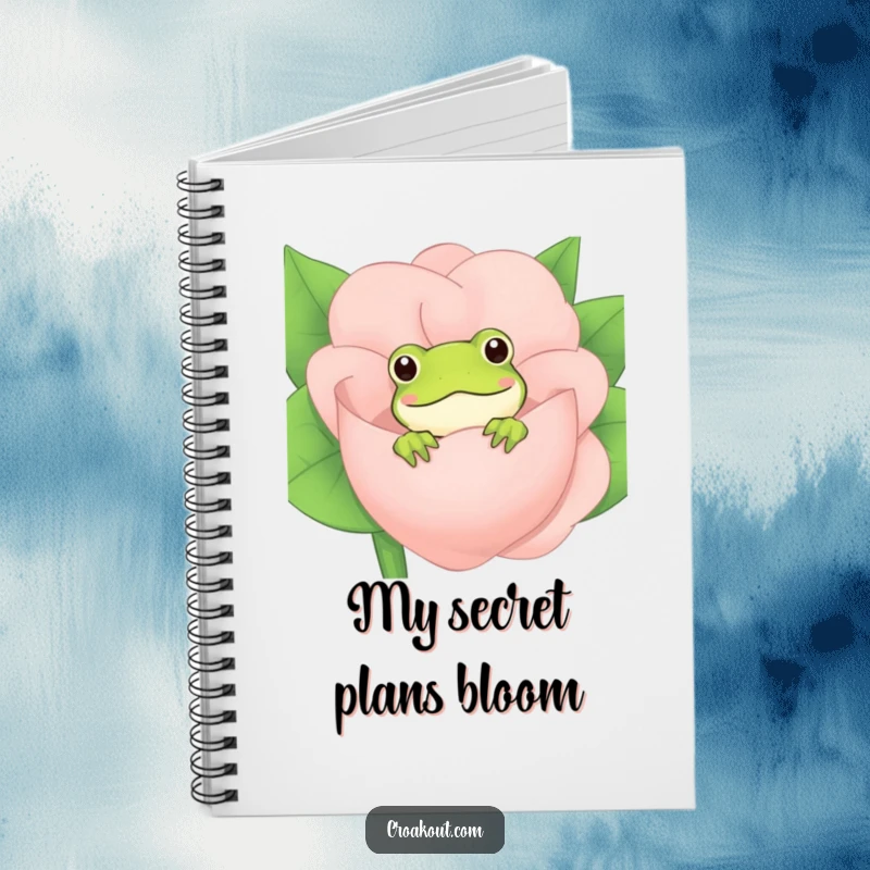 Funny Frog Notebook: A charming notebook with a cover design of a frog peeking from behind a flower, perfect for jotting down thoughts.