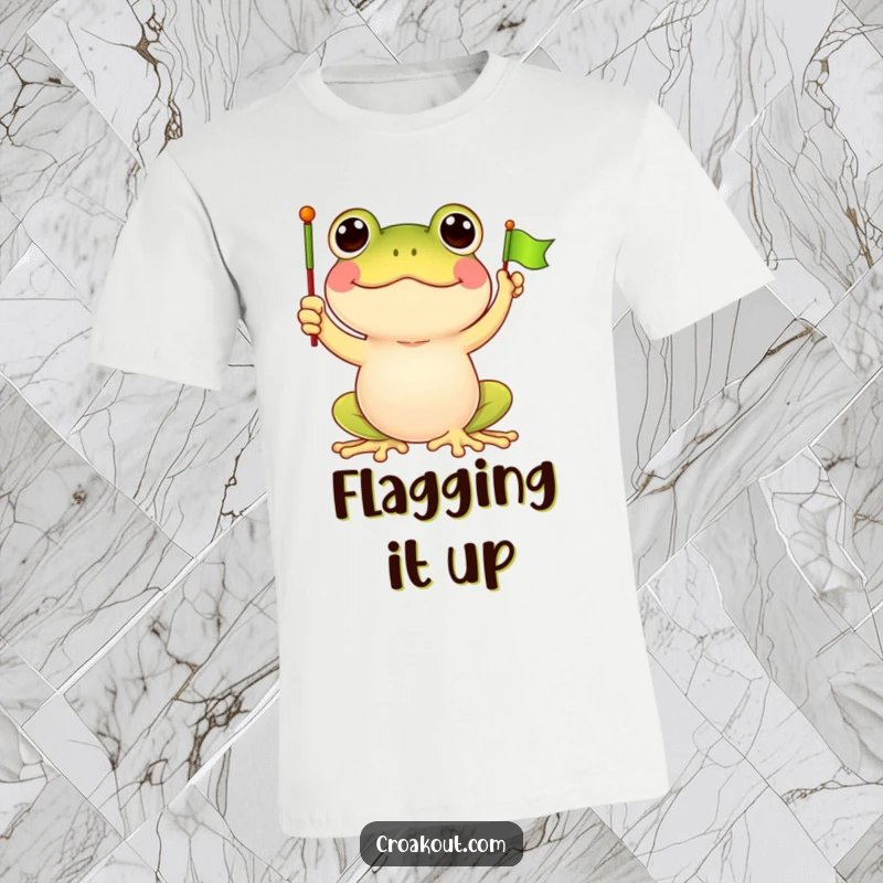 Funny frog t-shirt showcasing a happy frog character proudly waving a tiny green flag, symbolizing celebration and infectious good cheer.