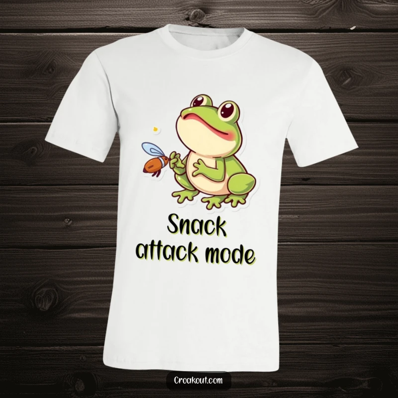 Funny frog t-shirt featuring a small amphibian with its tongue out, excitedly catching a fly in a humorous and action-packed design.