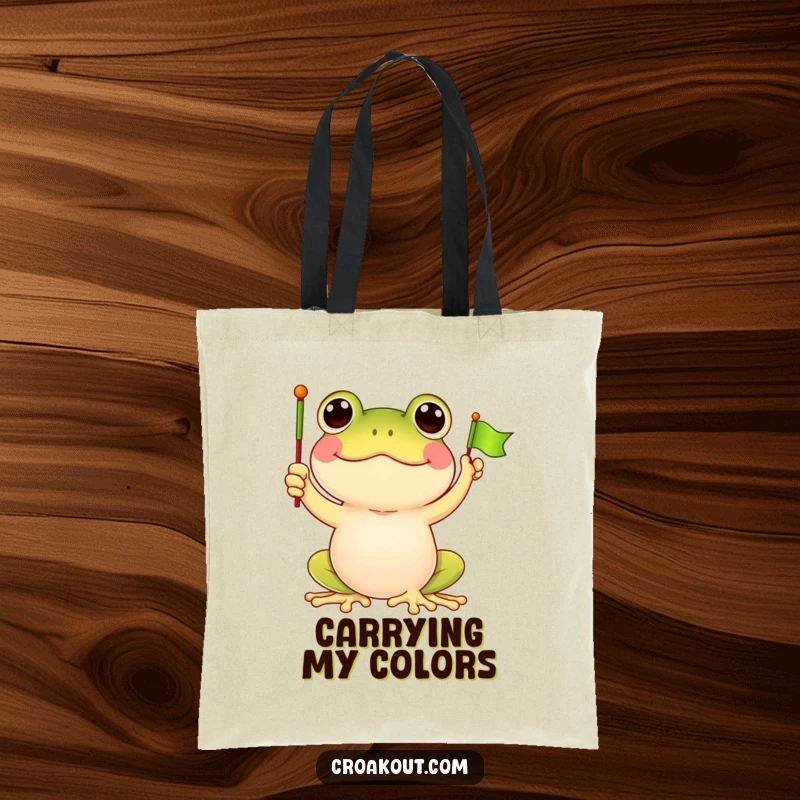 Funny frog tote bag with a delighted frog character waving a tiny green flag, ideal for carrying essentials with a dash of cartoon fun.