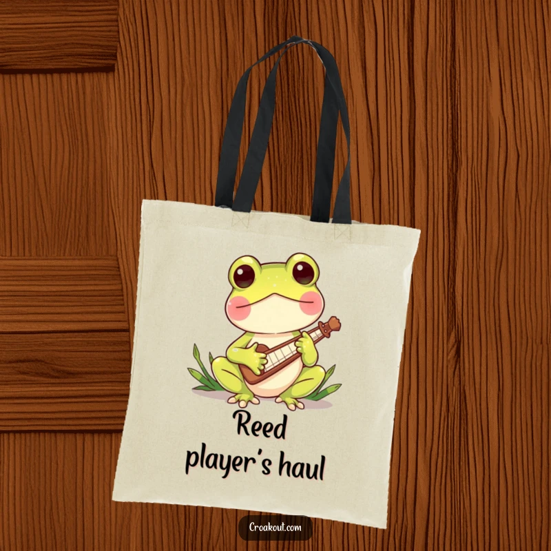 Funny tote bag with a charming frog character playing a miniature reed instrument, ideal for carrying music sheets and daily items with flair.